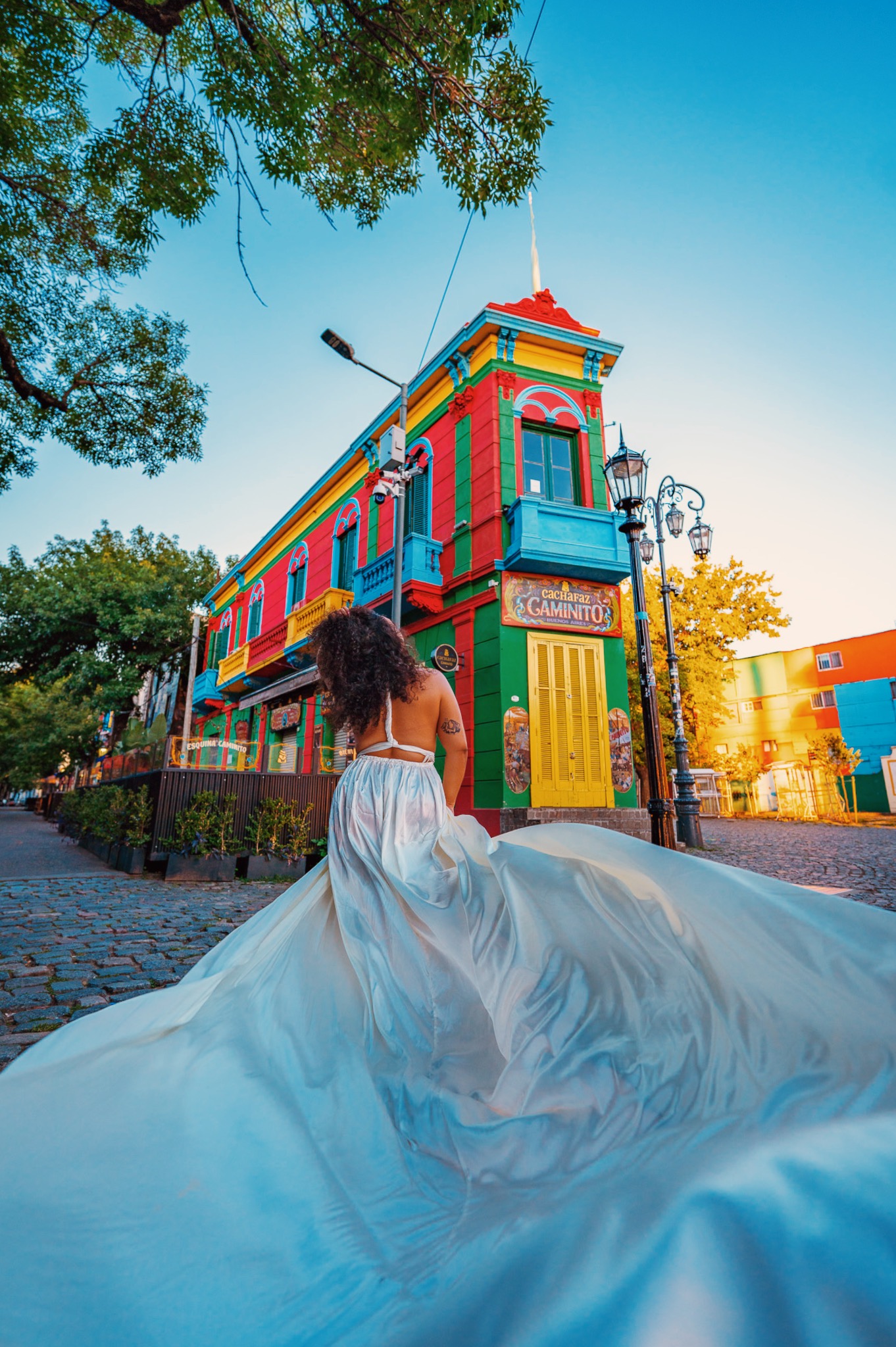 Photo of the author in a white dress in La Boca, Buenos Aires